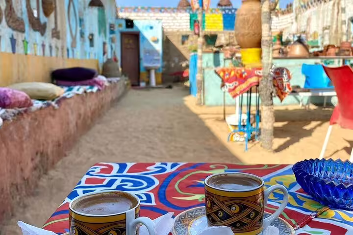 Traditional Nubian Village courtyard with tea cups during private Aswan motorboat tour with transfers