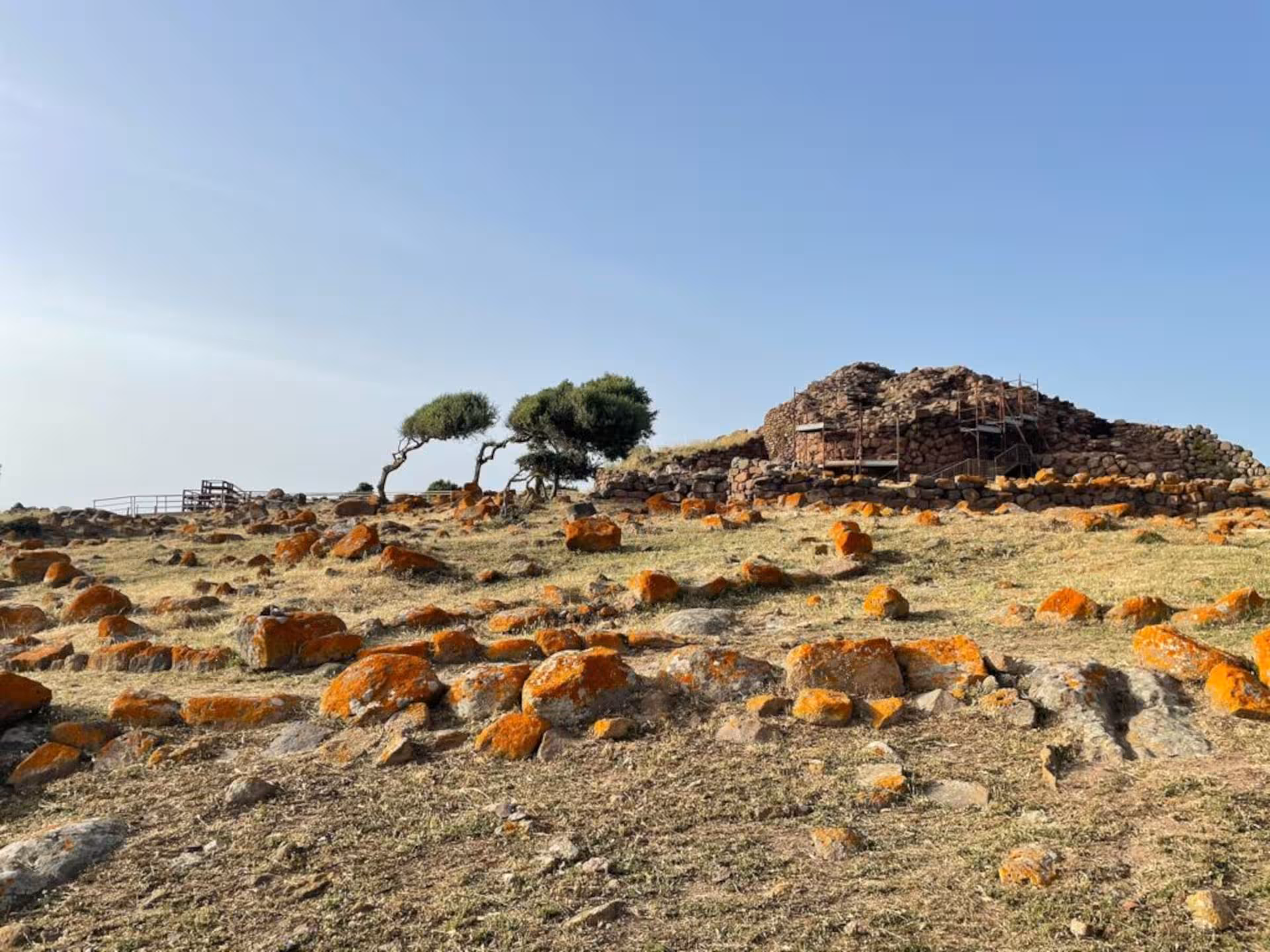 Explore the ancient Nuraghe Seruci in Gonnesa, Sardinia, surrounded by rugged landscape and historic stone structures.