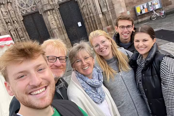 Friends selfie at Nuremberg Old Town cathedral, perfect for a self-guided scavenger hunt walking tour