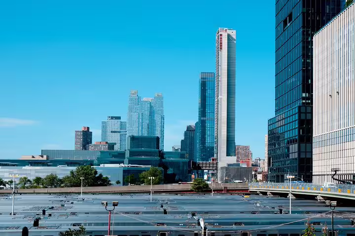 NYC skyline with skyscrapers and train yard viewed during outdoor self-guided exploration tour