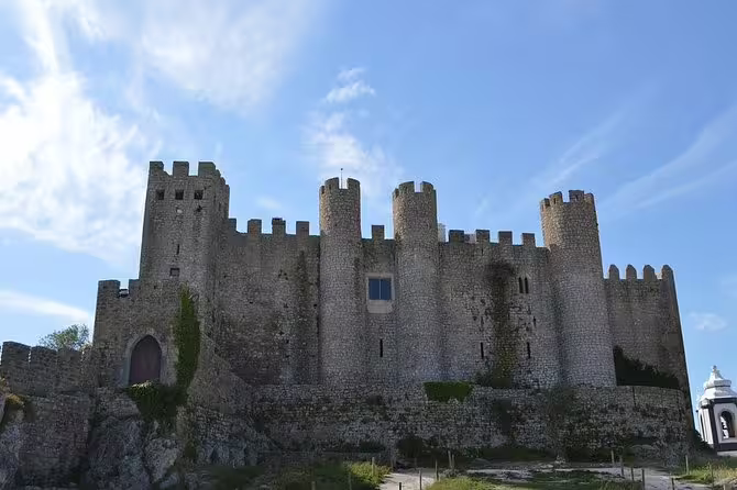 Explore the medieval charm of Obidos Castle on a day trip from Lisbon, featuring historical architecture and scenic views.