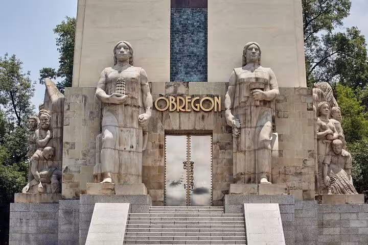 Monument to Álvaro Obregón with large stone sculptures and stairs in Chimalistac, Mexico City