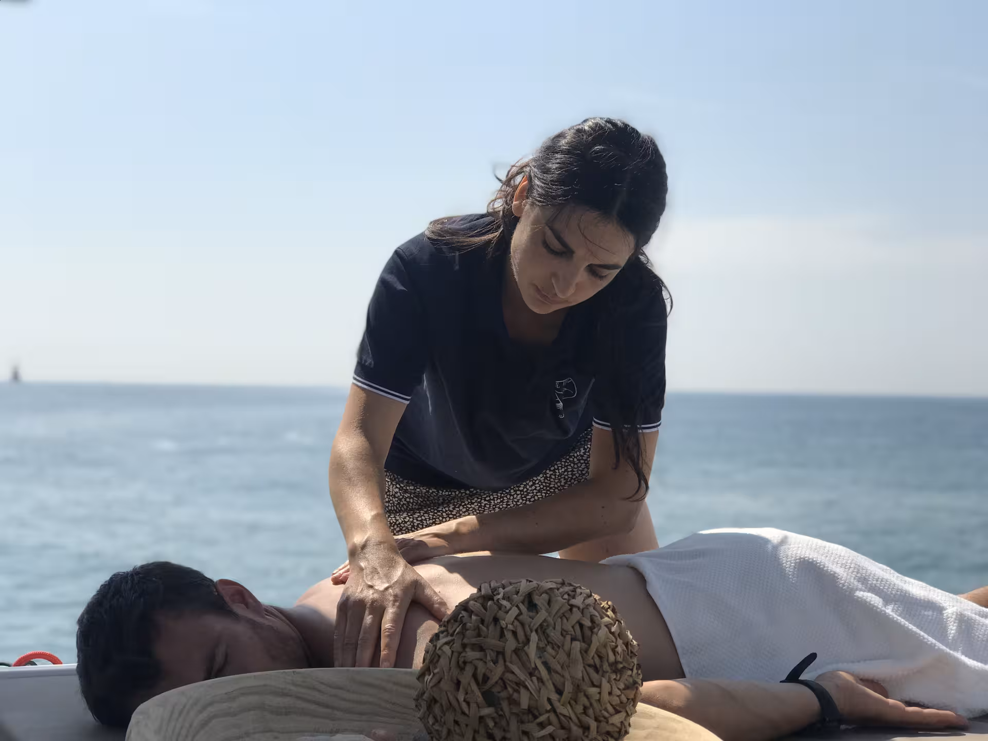 Onboard oceanfront massage session on a yacht for Wellness & Sea Breeze tour, relaxing bodywork at sea