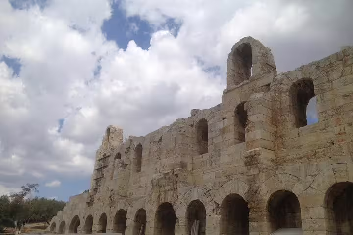 Ancient Roman arches of the Odeon of Herodes Atticus in Athens, seen on an Athens at Night small-group walk