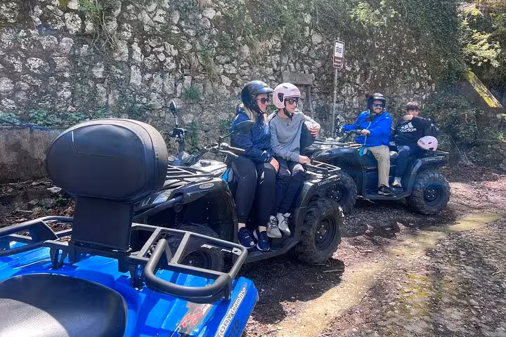 Group of adventurers on ATVs ready for an exciting ride on Mount Faito from Sorrento, showcasing fun and thrill.