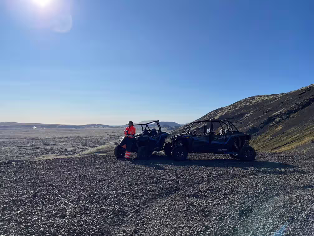 Off-road buggy adventure on rocky terrain with clear skies, part of the Adrenaline Combo experience featuring mega zipline thrills.