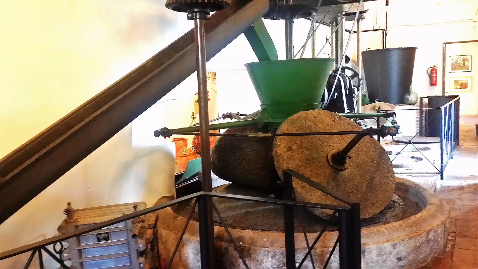 Traditional olive mill stone grinder in Ojen, authentic stop on private Costa del Sol day tour in Andalusia
