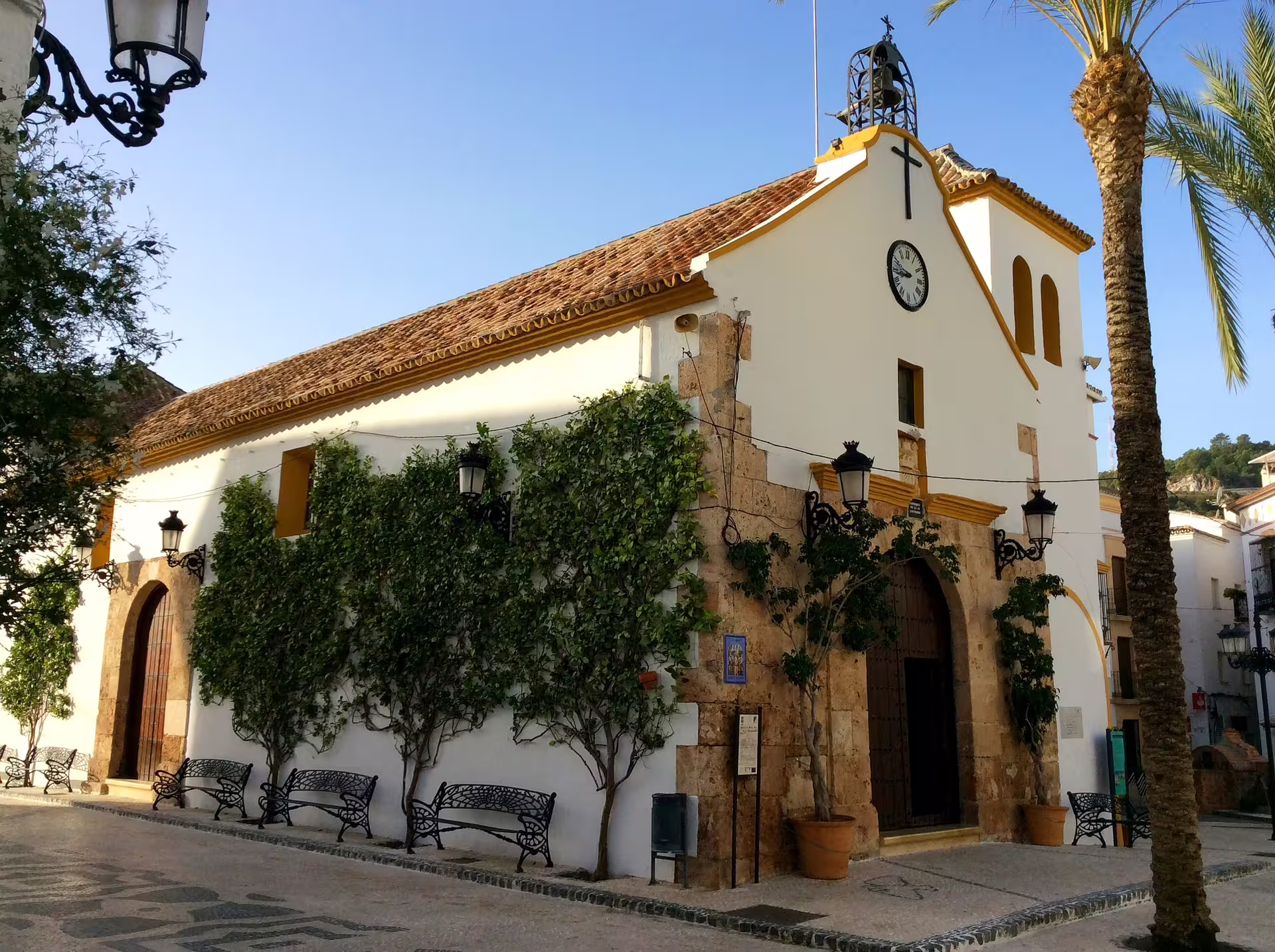 Whitewashed church in Ojen village square, a highlight of private tour from Costa del Sol, Andalusia Spain