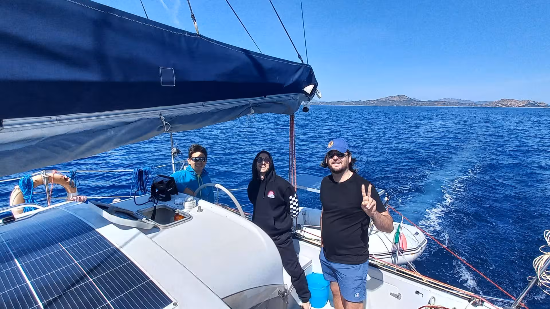 Enjoy a memorable day with friends on a catamaran sailing adventure from Olbia, capturing smiles and stunning sea views.