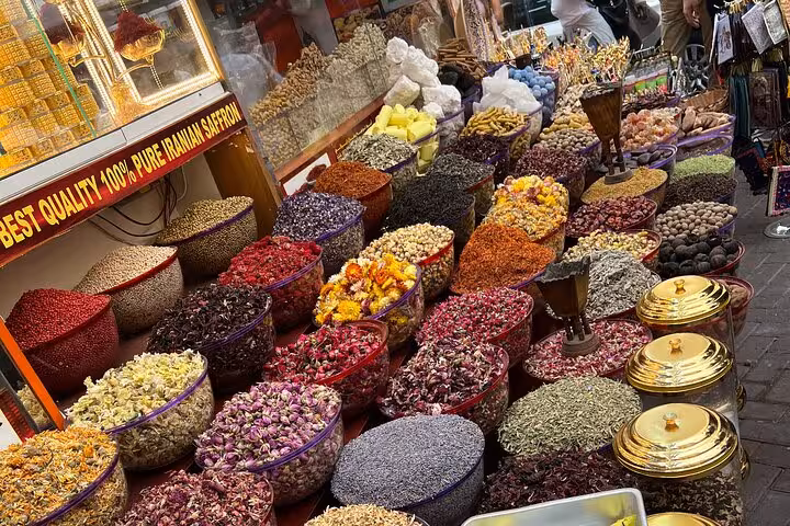 Colorful spice and dried flower market in Old Dubai souk, a stop on the 6 tastings walking tour