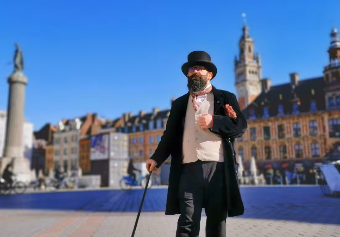 Costumed guide in top hat and Victorian attire walking through Grand Place, Lille