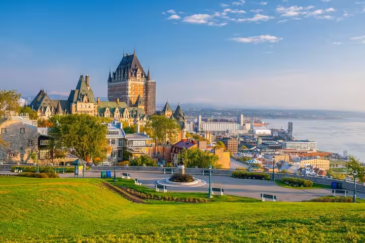 Panoramic view of Old Quebec City with Château Frontenac castle and St. Lawrence River on a sunny day