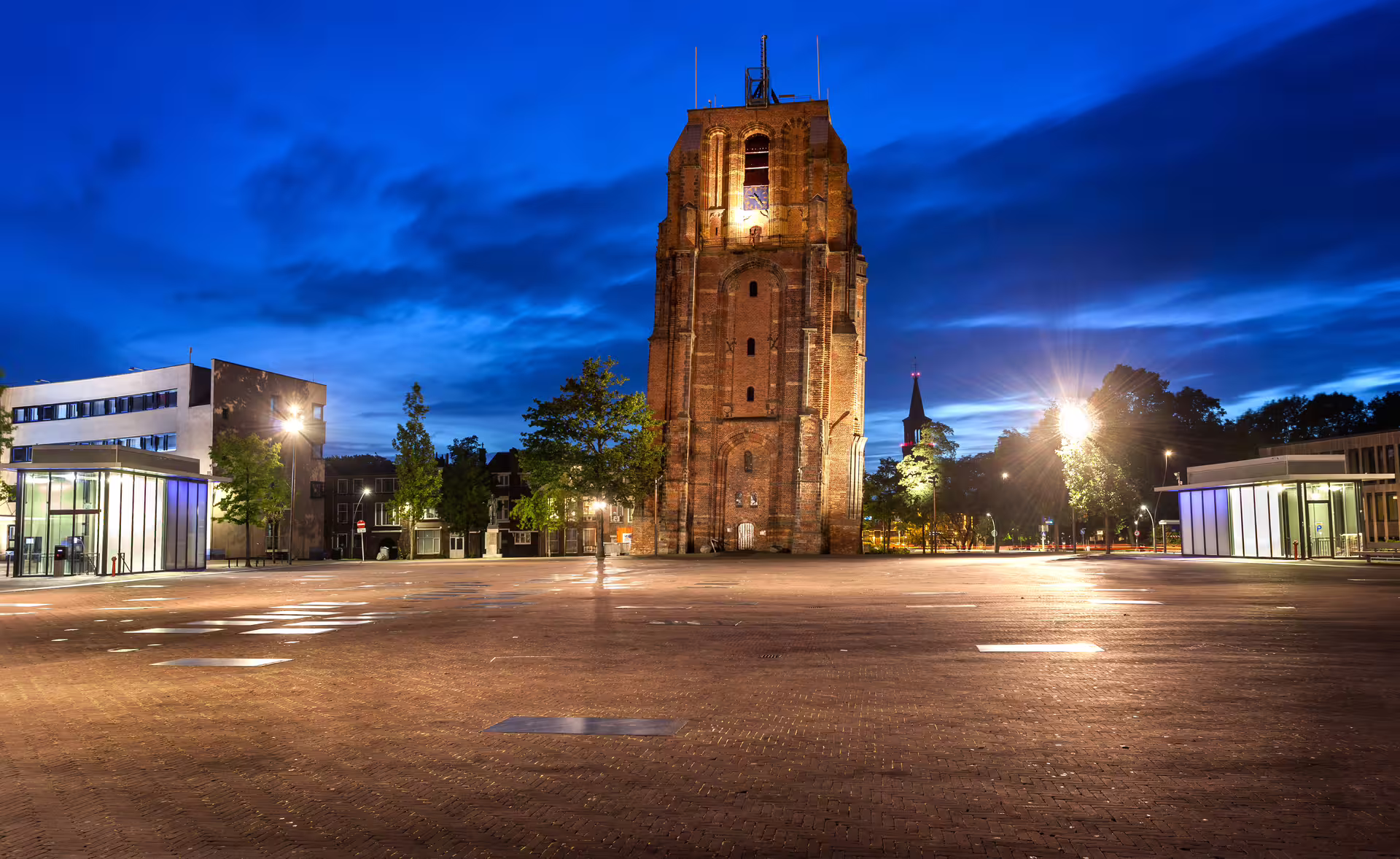 Oldehove tower at dusk in Leeuwarden, Netherlands, key stop on 1-day walking tour with multilingual audioguide