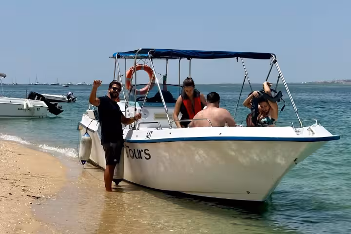 Boat landing on sandy shore in Ria Formosa during the From Olhão Armona and Culatra Islands boat tour