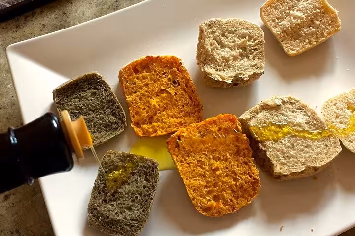 Freshly baked bread with olive oil tasting at Vieste's olive harvest tour.