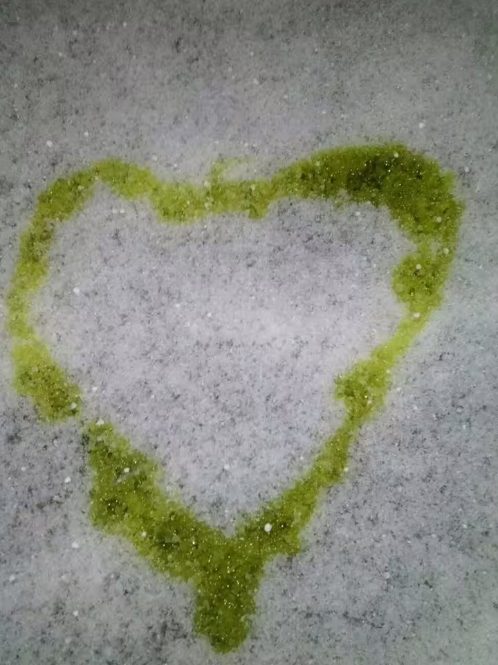 Heart shape drawn with extra virgin olive oil on stone, romantic Abruzzo olive oil tasting experience