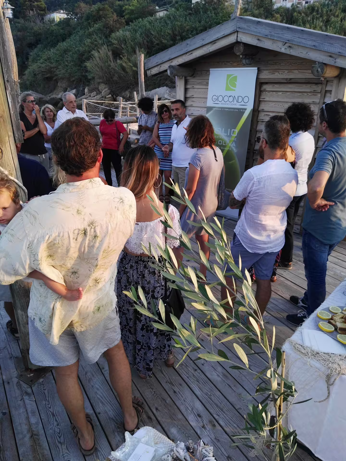 Group olive oil tasting in Abruzzo with local guide at seaside mill, sampling extra virgin oils outdoors
