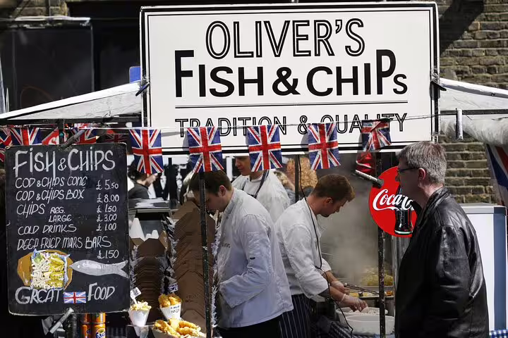 Oliver's Fish & Chips stall at Camden Market, showcasing traditional British street food with Union Jack decorations.