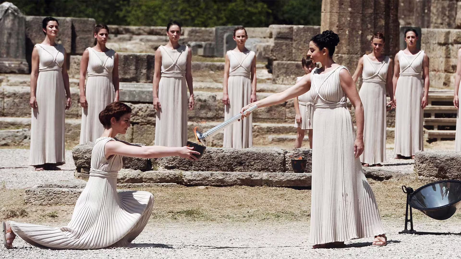 Olympic flame ceremony reenactment at Ancient Olympia ruins on a private day tour from Athens, Greece