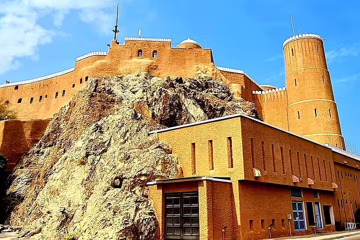 Discover the majestic forts of Oman, showcasing traditional architecture against a backdrop of rocky landscapes.