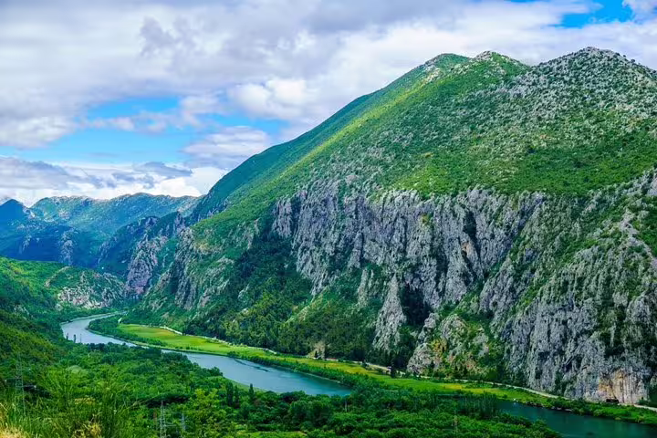 Scenic River Cetina canyon near Omiš with emerald water and limestone cliffs on boat tour with lunch from Makarska