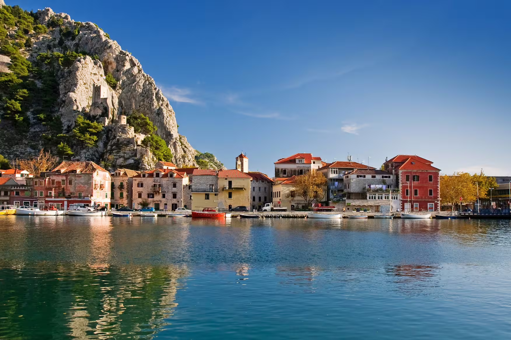 Omiš waterfront and fortress cliffs on Croatia’s Dalmatian Coast, scenic stop on a self-drive road trip