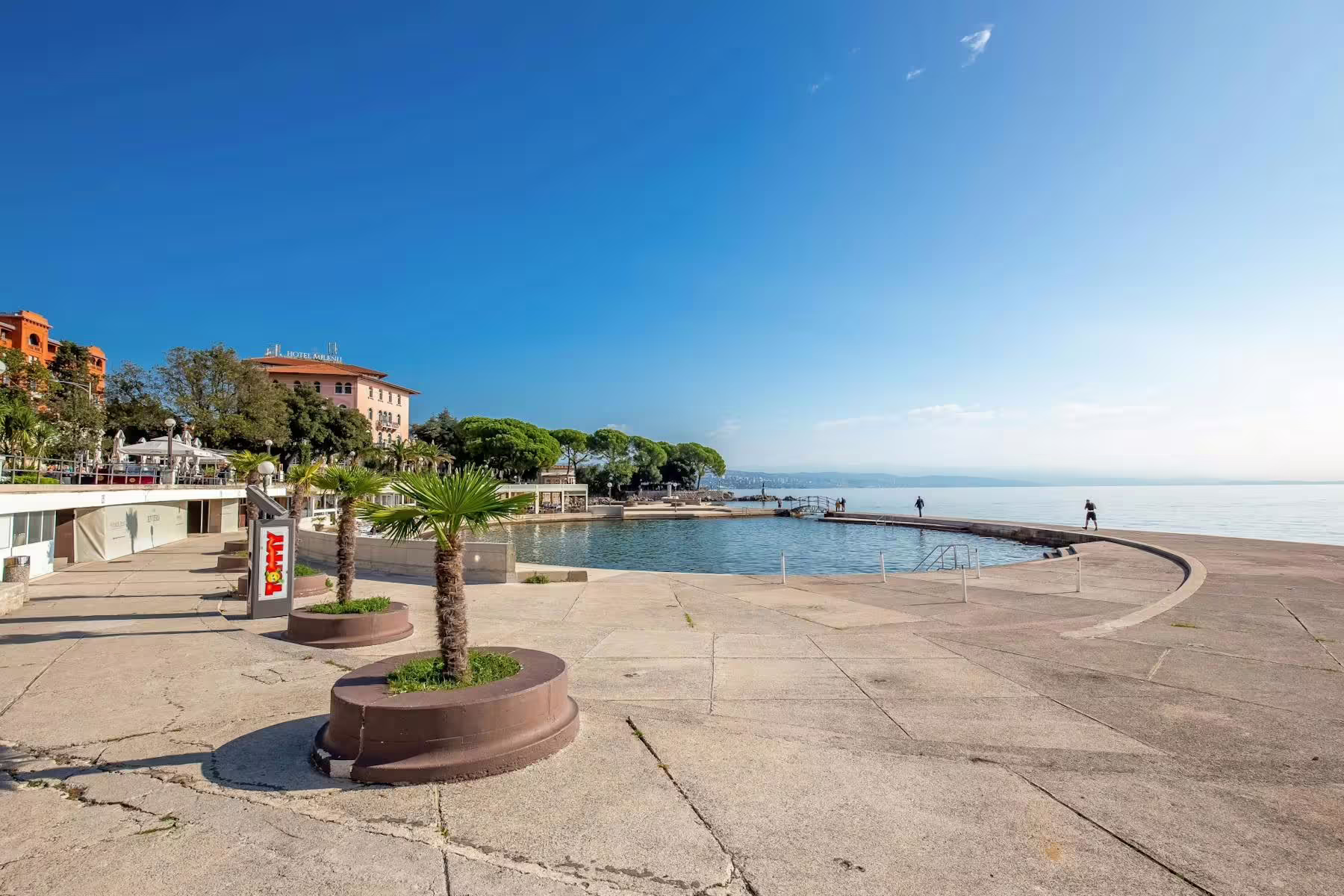 Opatija seaside promenade with palm trees and calm Kvarner Bay views, highlight of Opatija Lovran tour