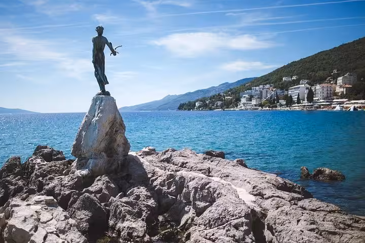 Statue on rocky shore in Opatija with Adriatic Sea views, classic photo stop on Zagreb private day trip