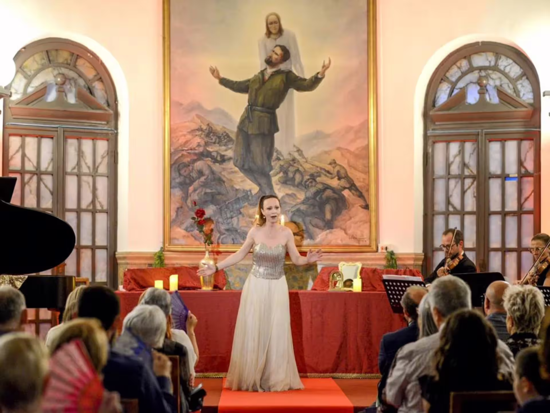 Opera singer performs passionately in Verona Palace, captivating audience with classical music and prosecco ambiance.