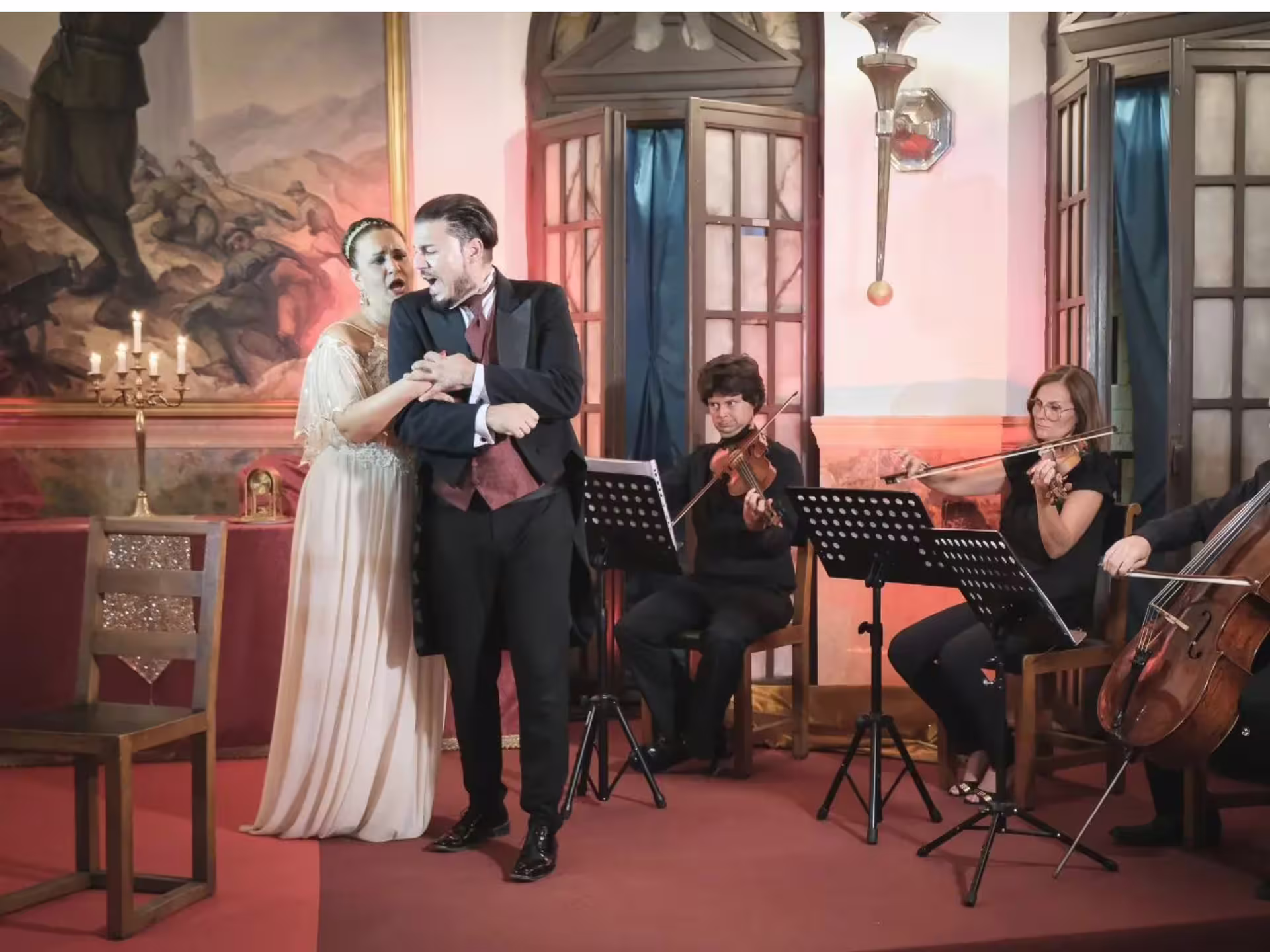 Musicians performing with string instruments at an opera concert in Verona Palace, creating a classical ambiance.
