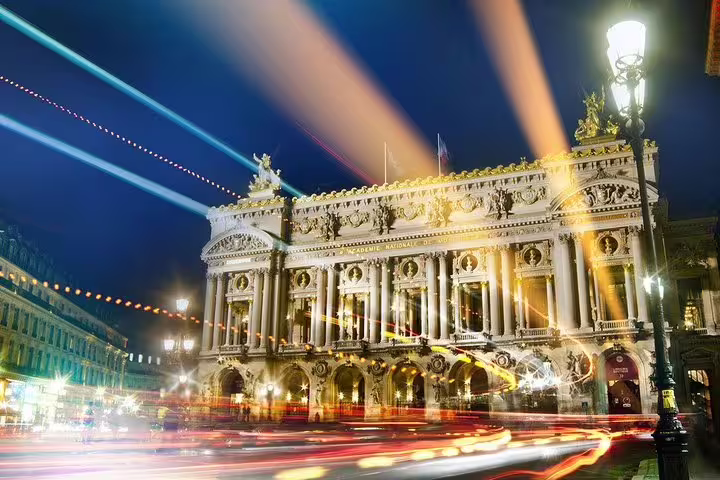 Opéra Garnier illuminated with light trails, private Paris by night sightseeing tour in a luxury car