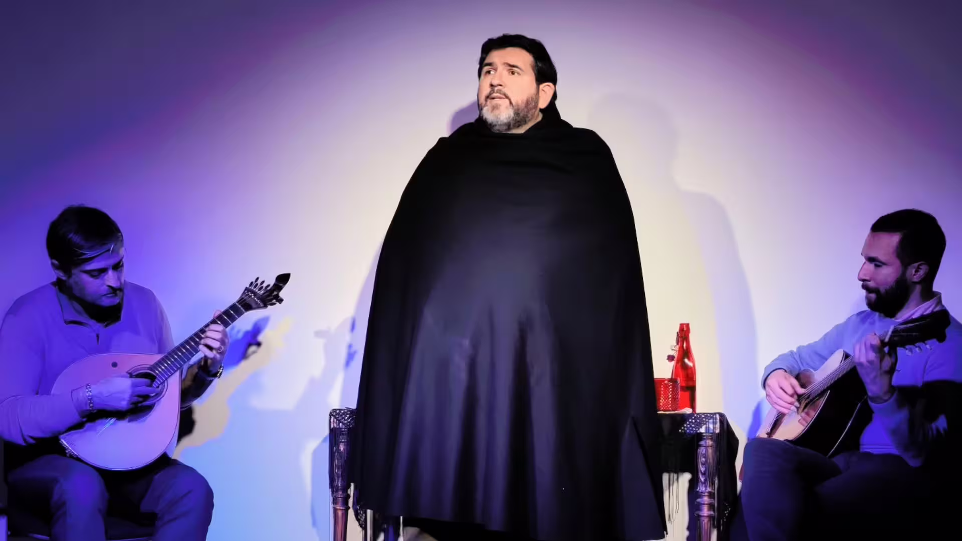 Image of a Fado male singer performing on Cooltour Oporto's Porto Fado & Wine Tour