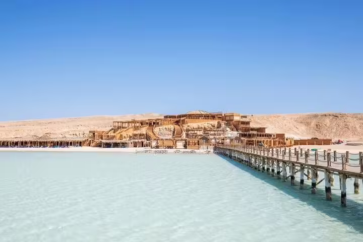 Orange Bay Island lagoon with long wooden pier, part of VIP boat snorkeling day trip from Hurghada, Red Sea Egypt