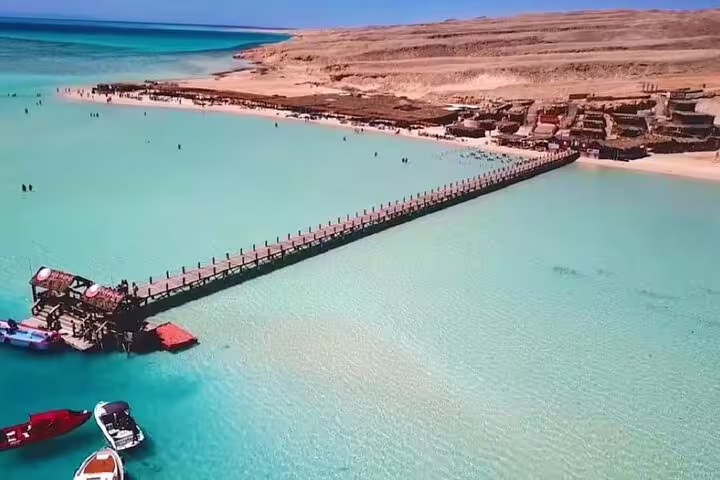 Aerial view of Orange Bay Island jetty over turquoise lagoon, VIP boat snorkeling day trip from Hurghada