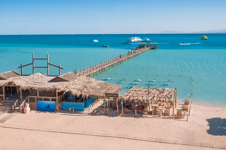 Orange Bay Island pier and turquoise lagoon, VIP boat trip from Hurghada with full-day snorkeling stop