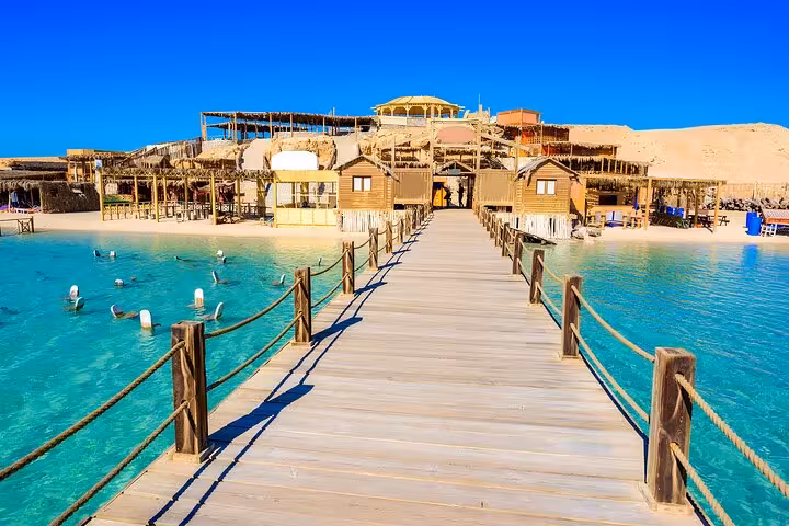 Wooden pier at Orange Bay Island Hurghada with turquoise lagoon, ideal stop for snorkeling, lunch and drinks