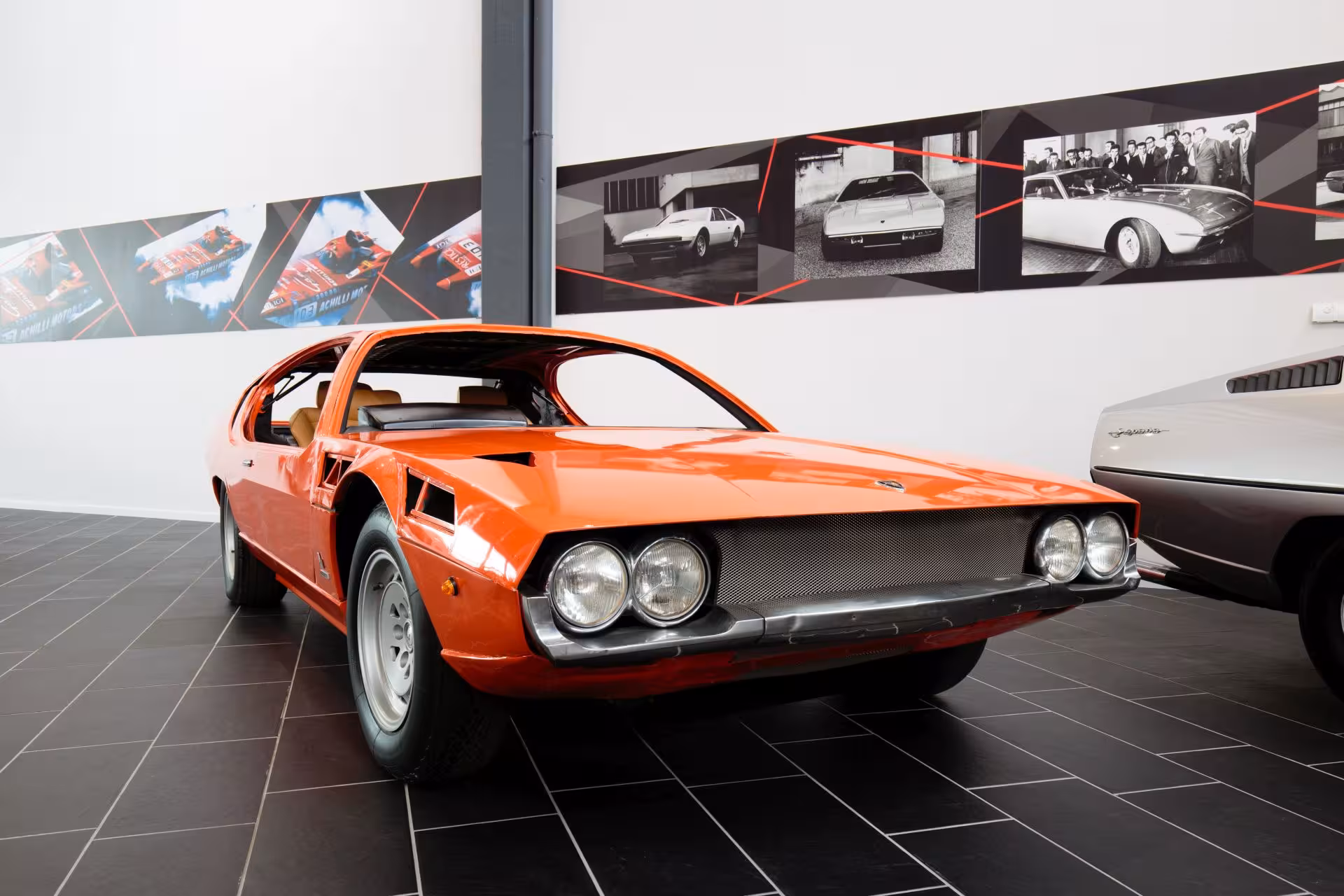 Orange classic Lamborghini on display at Lamborghini Museum, part of Ducati and Ferrari museums combo tour