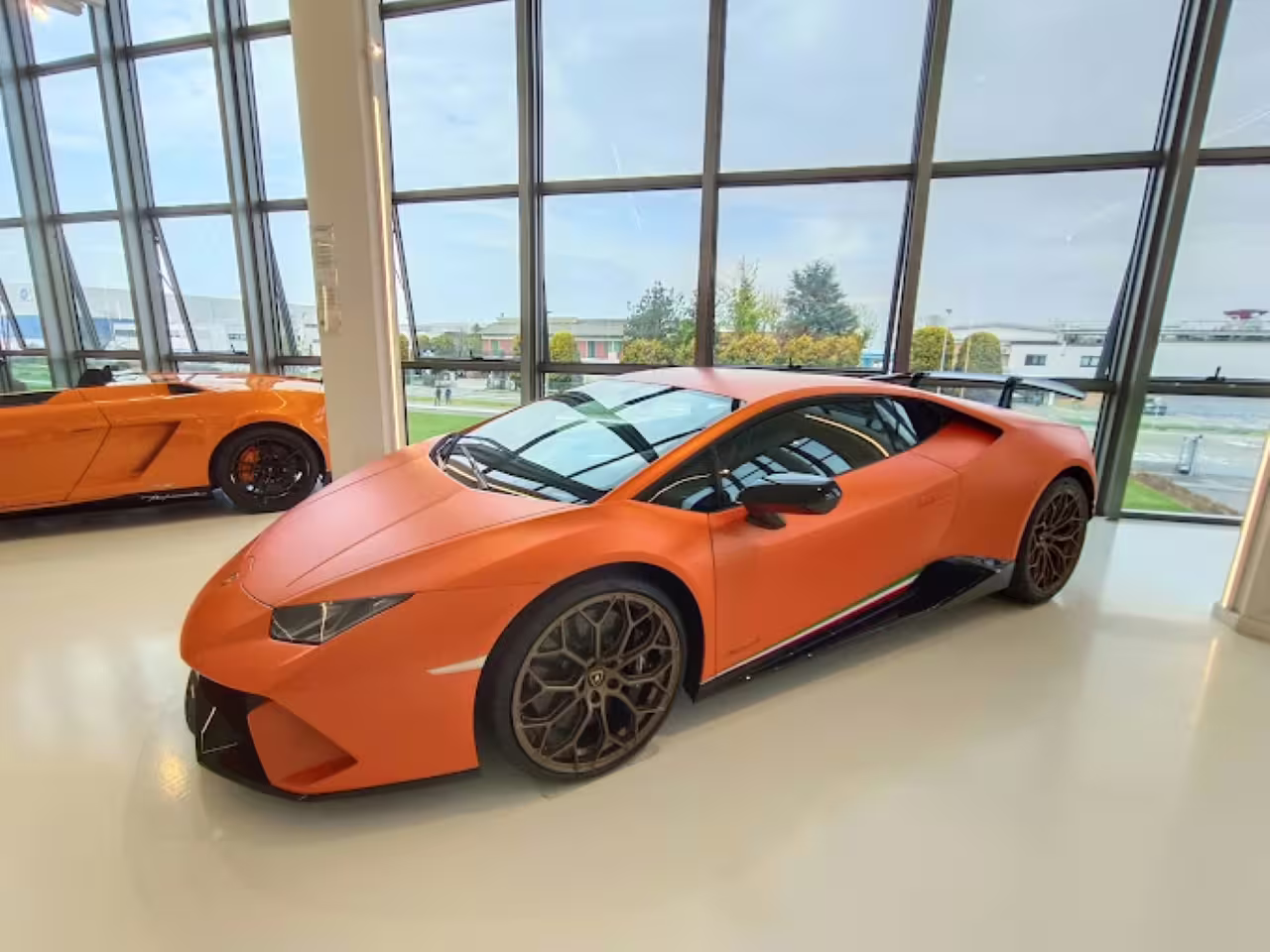 Orange Lamborghini supercar on display at Lamborghini Museum near Bologna, entry ticket tour highlight