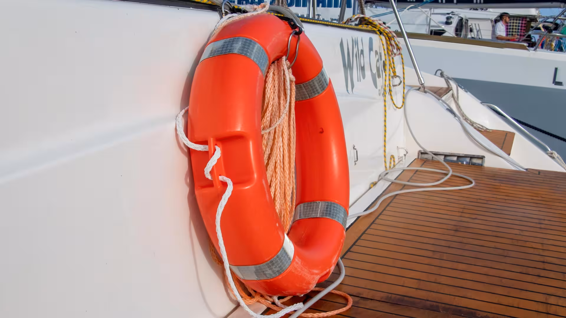Orange life preserver on catamaran deck, ensuring safety on the Asinara Island tour from Stintino.
