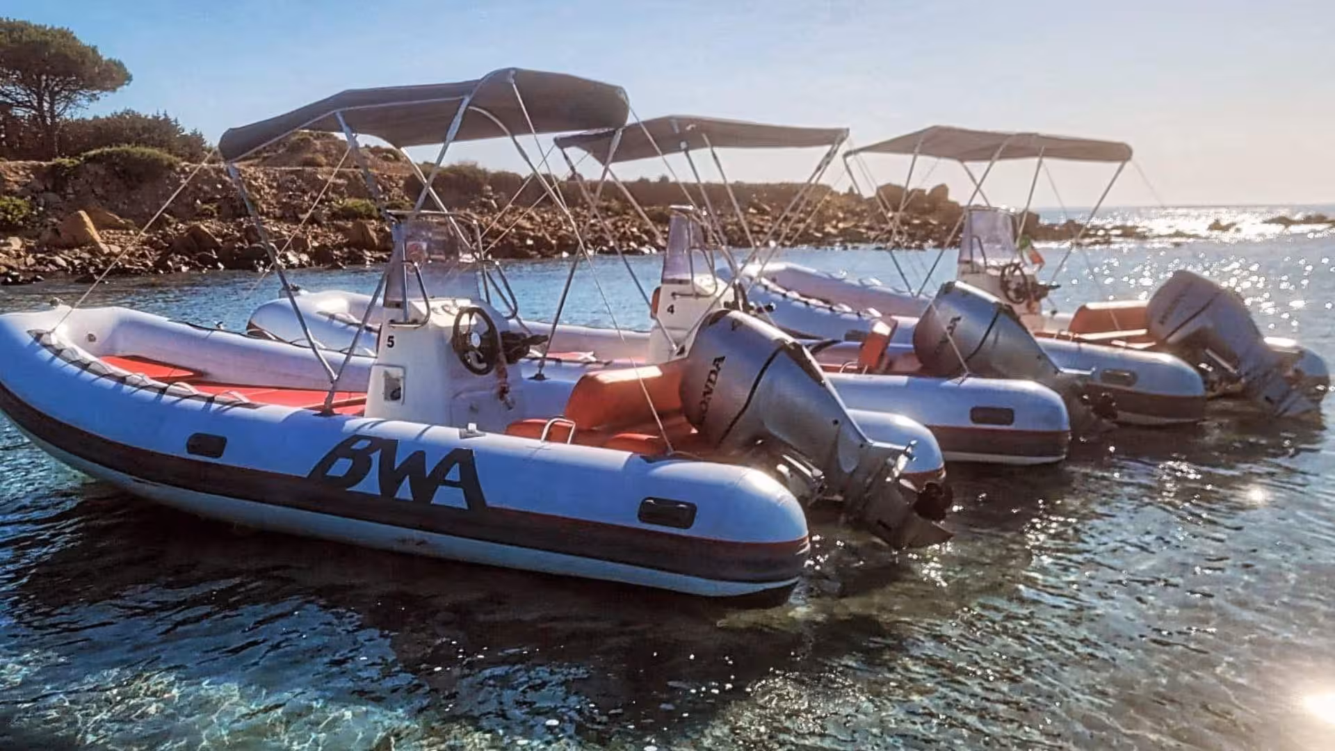 Set sail on sleek dinghies, perfect for a scenic tour between Cala Ginepro and Cala Goloritzè.