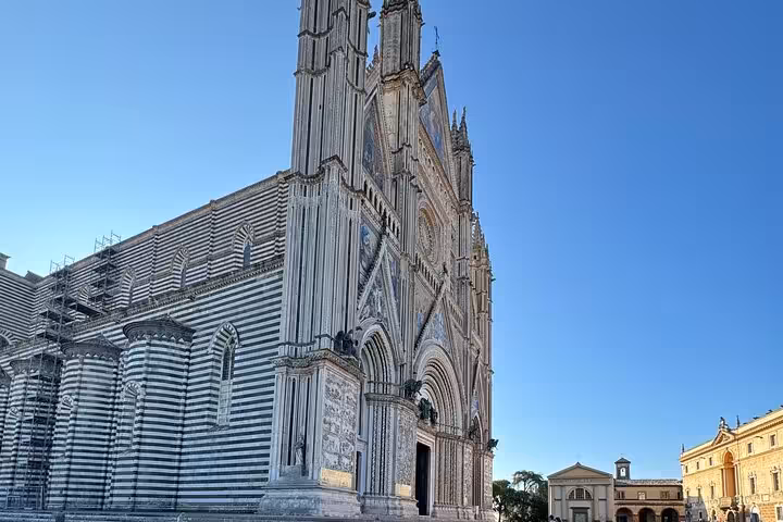 Magnificent striped Gothic Orvieto Cathedral exterior on a scenic private transfer day trip from Rome Italy