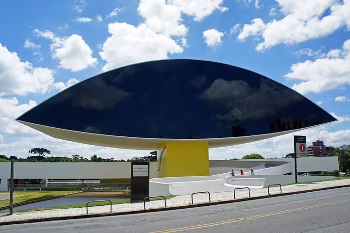 Explore the iconic Oscar Niemeyer Museum with its eye-shaped design on the full-day Curitiba city tour.