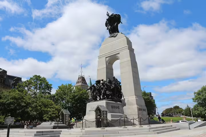 National War Memorial monument with bronze sculptures in Ottawa city center on a sunny day