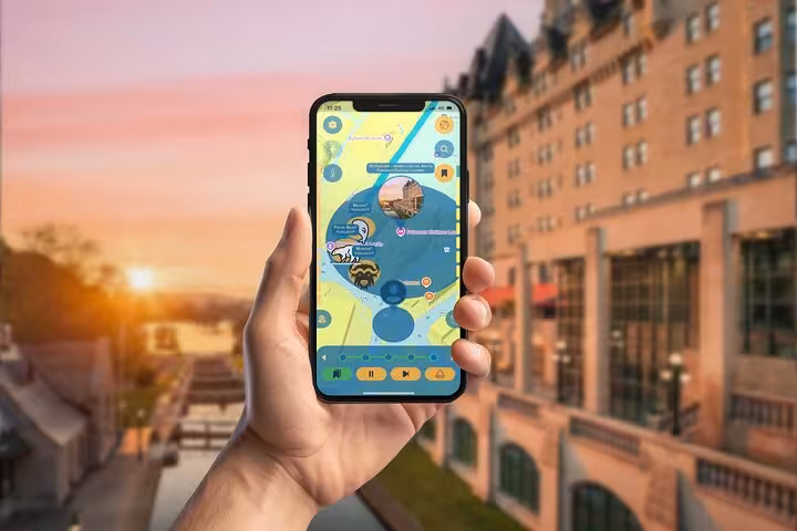 Hand holding smartphone displaying Ottawa self-guided walking tour wildlife scavenger hunt app map at sunset