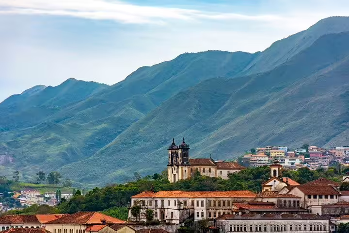 Historic Ouro Preto with its iconic baroque churches set against the backdrop of Minas Gerais mountains.