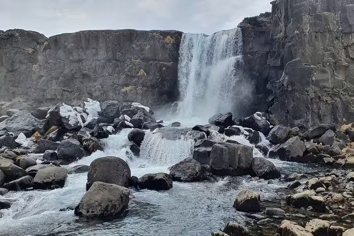 Öxará waterfall cascading over basalt rocks at Þingvellir National Park on Golden Circle tour