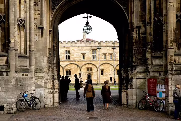 Oxford college archway entrance with visitors, ideal stop on a self-guided scavenger hunt highlights tour