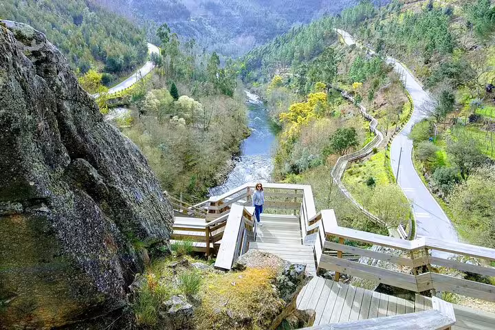 Scenic view of the Paiva Walkways with lush greenery and winding river, highlighting the Arouca Suspension Bridge tour experience.