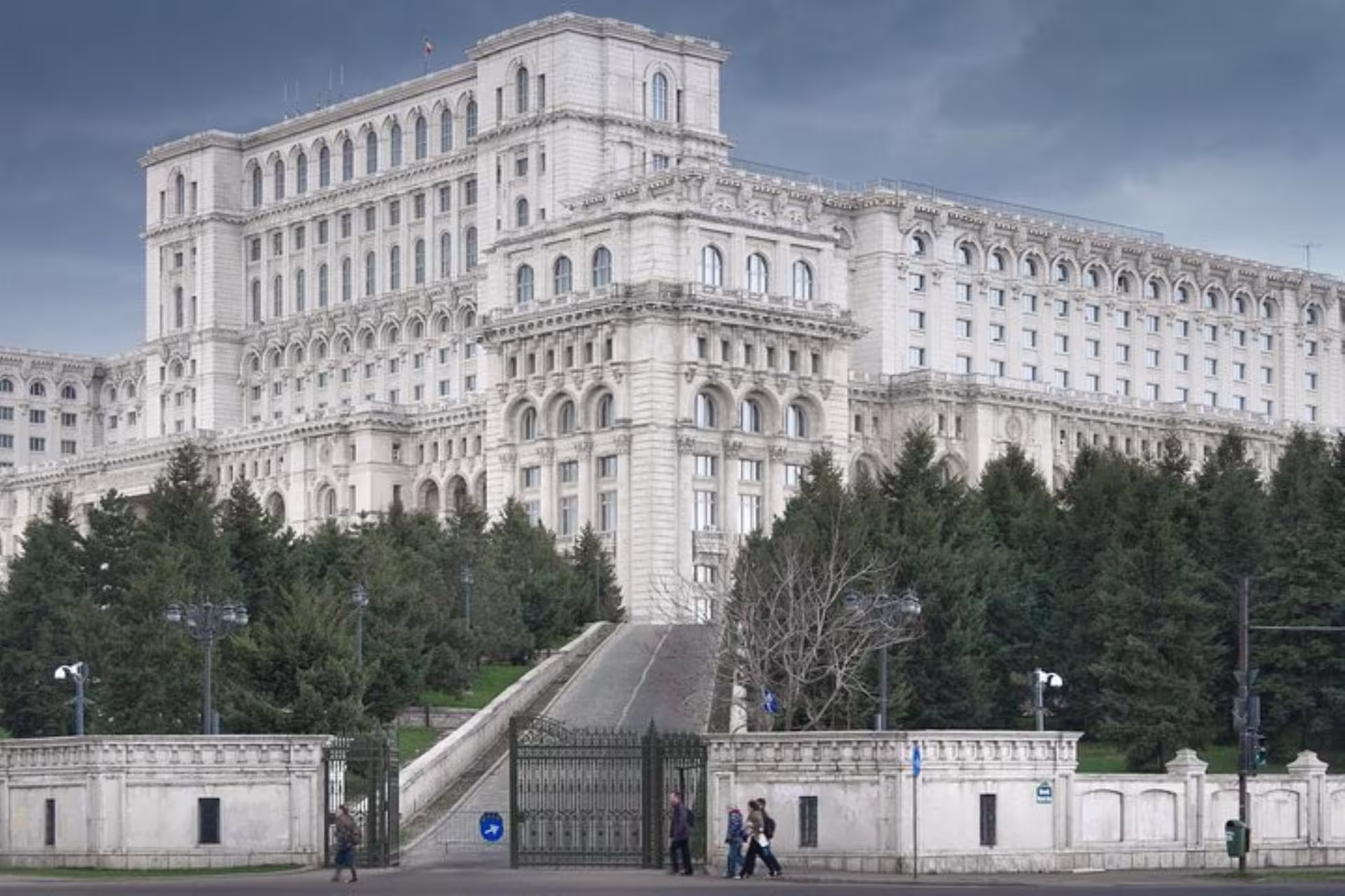 Exterior view of the grand Palace of Parliament in Bucharest, an iconic stop on Spanish guided tours.