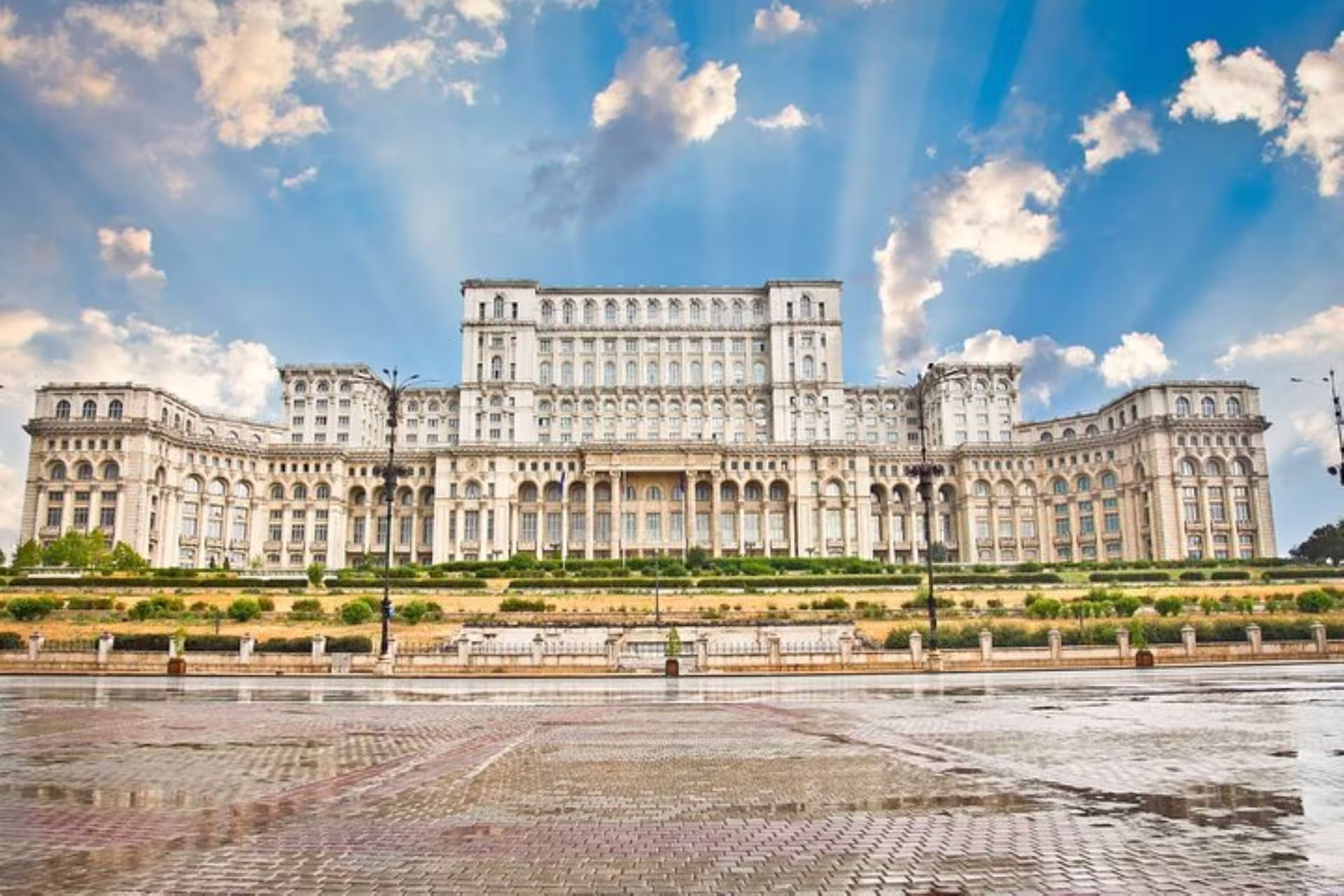 Marvel at the impressive exterior of the Palace of Parliament in Bucharest, perfect for a guided tour.